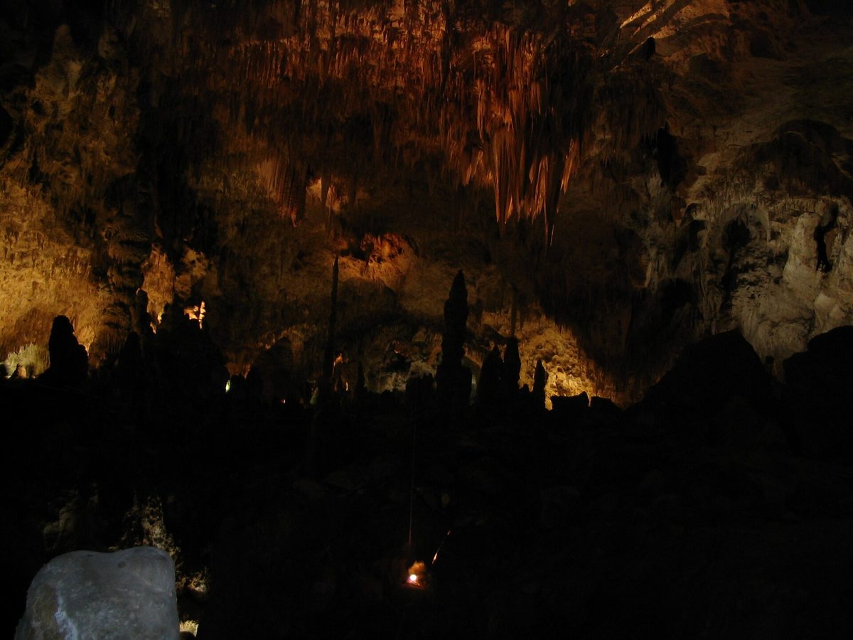 Stalactites and stalagmites lit inside Carlsbad Caverns National Park.